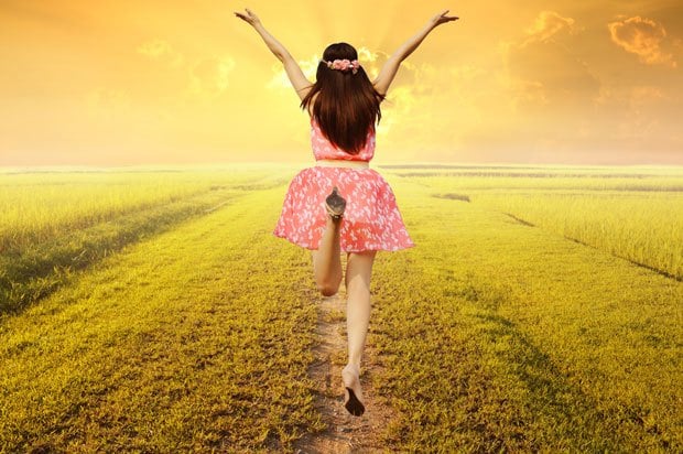 Girl jumping in a field
