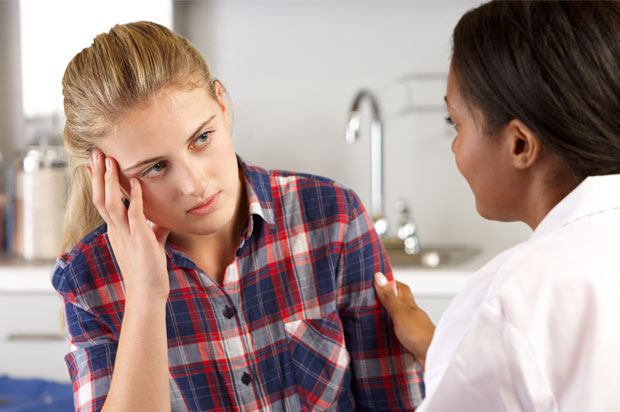 Girl speaking to a doctor