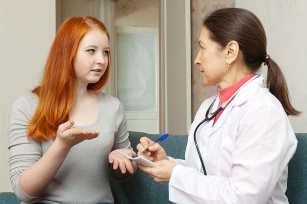 Girl talking to her doctor