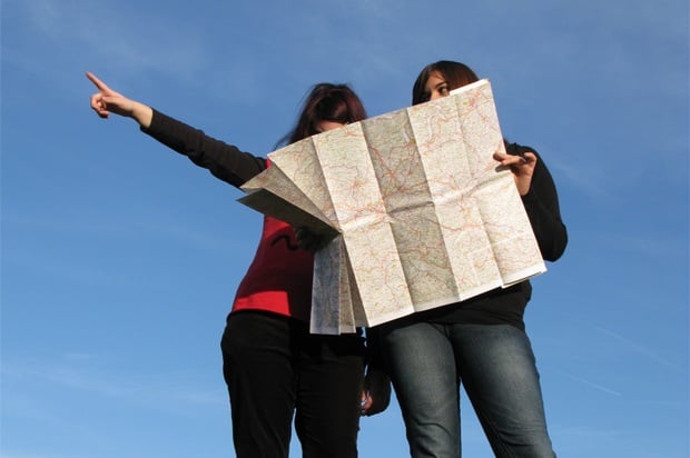2 Girls looking a map