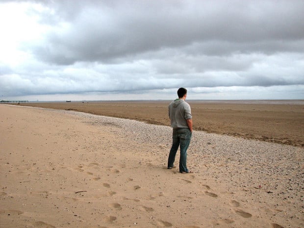 boy standing on beach