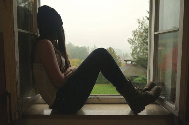 sad girl in window