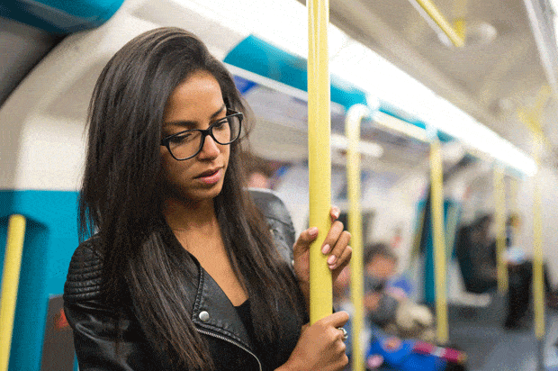 nervous looking woman on london tube train