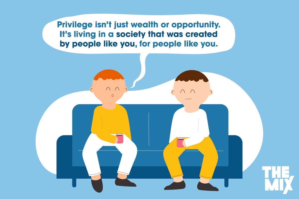 Two young white men are having a conversation about privilege. The speech bubble above them says, "Privilege isn’t just wealth or opportunity. It’s living in a society that was created by people like you, for people like you."